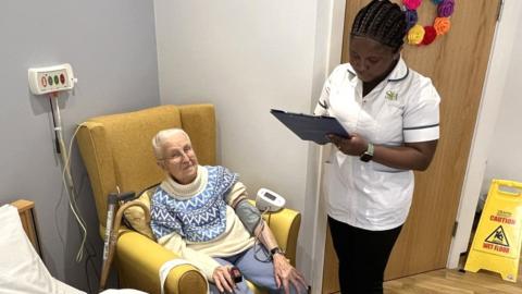 Ghanaian Harriet Mensah, 28, a nurse with Stow Healthcare based in Ford Place care home in Thetford, Norfolk, and Mary