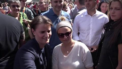 Ana Brnabic (left) at pride march in Belgrade