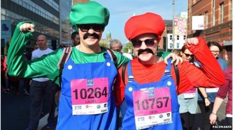 Runners in Mario and Luigi costumes