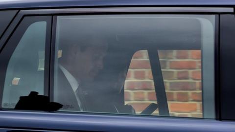 An image showing the Prince and Princess of Wales in the back of a car