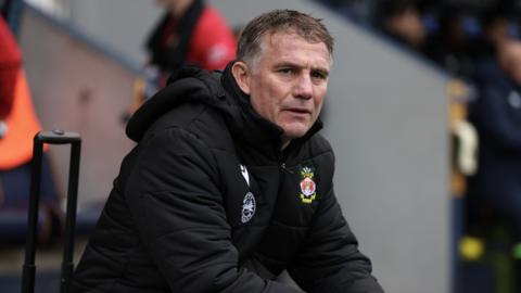 Wrexham boss Phil Parkinson looks on