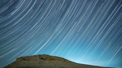 A meteor streaks across the night sky in Bazhou, Xinjiang Province, China, in the early morning of December 14, 2021.