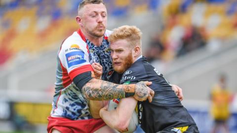 Leigh's Josh Charnley performs a tackle against York