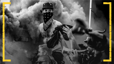 A Detroit City FC fan surrounded by pyrotechnic smoke
