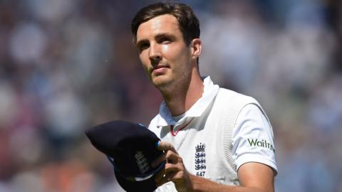 Steven Finn holds his cap during an England Test match