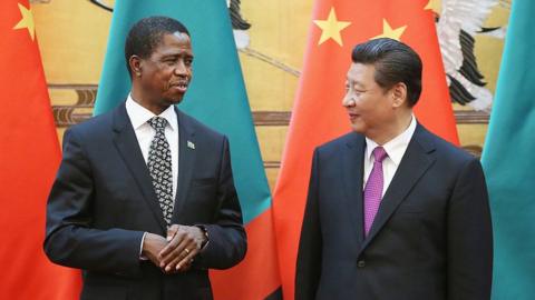 MARCH 30: Chinese President Xi Jinping (R) talks with Zambia's President Edgar Chagwa Lungu (L) during a signing ceremony at the Great Hall of the People on March 30, 2015
