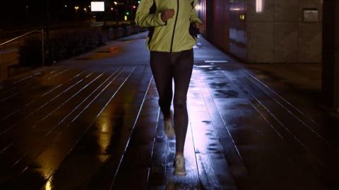 woman running at night