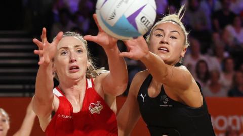 New Zealand's Whitney Souness and England's Jade Clarke go for the ball