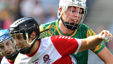 Derry's Niamh Quinn is challenged by Grace Coleman in the intermediate final