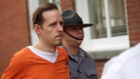 Eric Frein exits the Pike County Courthouse with police officers after an arraignment in Milford, Pennsylvania (31 October 2014)