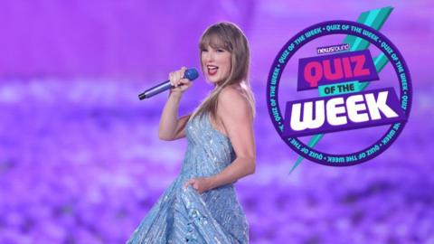 taylor swift smiling and performing holding a microphone on a big stage with the quiz of the week logo