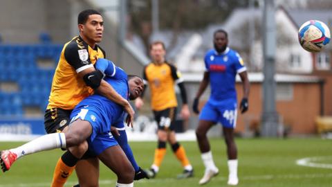 Newport's Priestley Farquharson in action against Michael Folivi