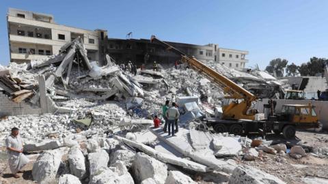 Buildings destroyed by an explosion at an arms depot in Sarmada, Idlib province, Syria (13 August 2018)