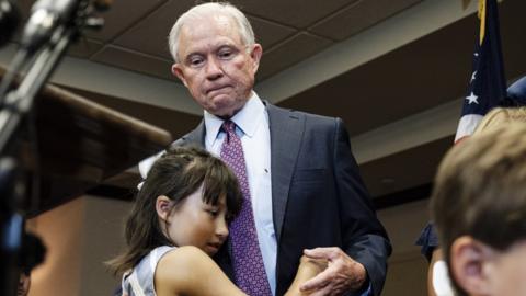 Sessions with his granddaughter after his concession speech in Mobile, Alabama, on 14 July 2020