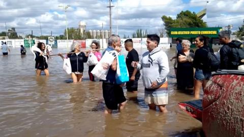 People stood in knee-deep water