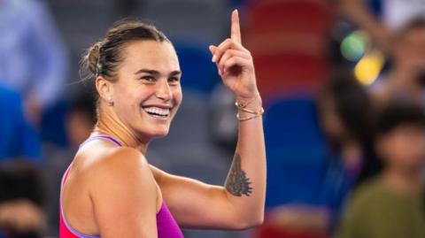 Aryna Sabalenka celebrating after winning her third-round match at the Wuhan Open