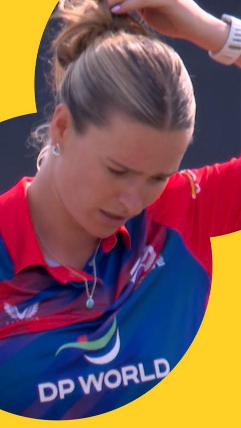 Lauren Bell hangs her head in disappointment with her fielders