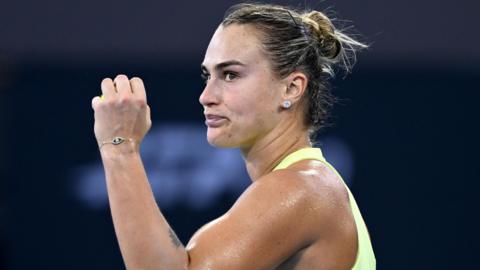 Aryna Sabalenka celebrates after beating Madison Keys
