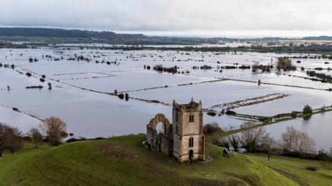 Burrow Mump standing above flooding fields in the Burrowbridge area of Somerset. The photo is from 10 February 2026 after a prolonged period of wet weather including Storm Chandra.