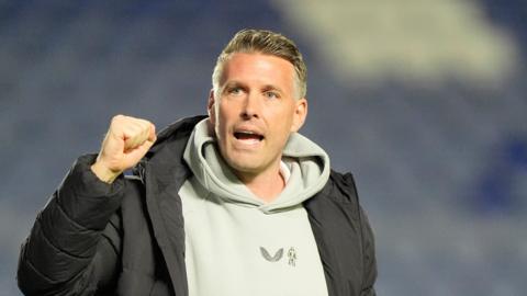 Rob Edwards clenches his fist towards Middlesbrough fans at the end of their win over Sheffield Wednesday