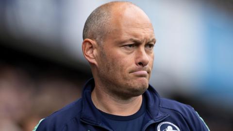 Alex Neil looks on at a Millwall game from the sidelines 