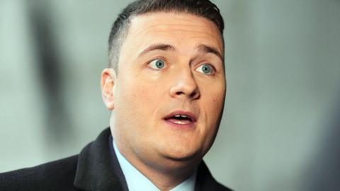 Wes Streeting - a 41-year-old man with short dark hair and clean-shaven. His mouth is slightly open as though he is talking.