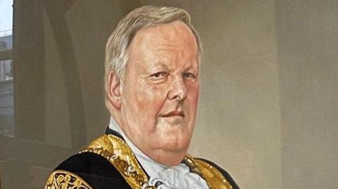 The portrait of former Belfast Lord Mayor Lord Browne on display inside Belfast City Hall.