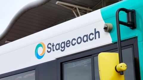 The top of a bus with "Stagecoach" in navy text next to its blue, green and yellow logo