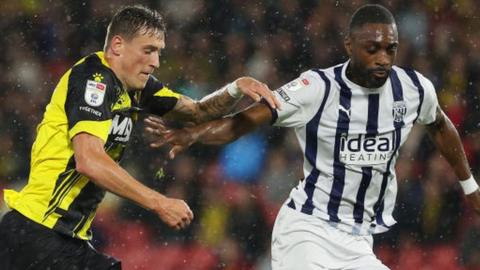 Watford's Mileta Rajovic and West Brom's Semi Ajayi