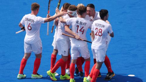 Great Britain's men celebrate victory over France in the hockey