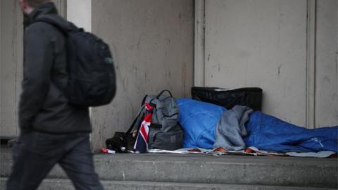 Man sleeping in doorway