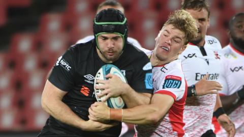 Morgan Morris of the Ospreys tries to break a tackle