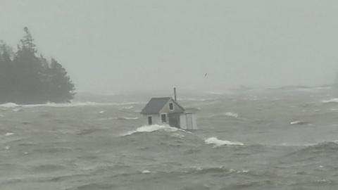 Cabin floating in storm
