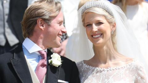 Newlyweds Mr Thomas Kingston and Lady Gabriella Windsor smile after their wedding at St George"s Chapel