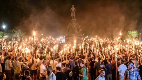 White nationalists participate in a torch-lit march on the grounds of the University of Virginia
