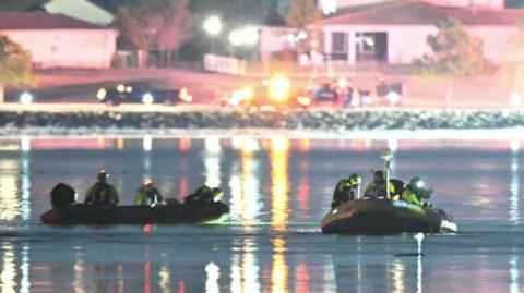 Rescue operation teams after a plane crash in Washington DC