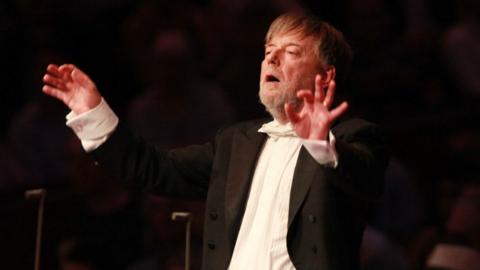 Conductor Sir Andrew Davis leads the BBC Symphony Orchestra and Chorus in 'The Kingdom' by composer Edward Elgar on stage for the First Night Of The Proms at Royal Albert Hall on July 18, 2014
