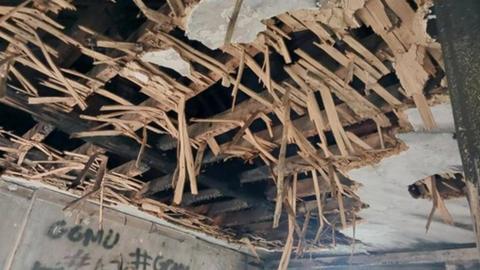 A picture of a fire damaged ceiling