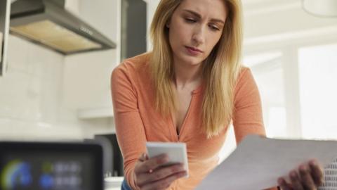 A woman calculating child costs