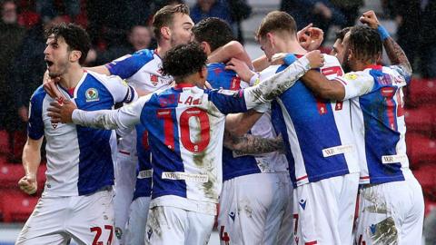 Blackburn players celebrate their late winner