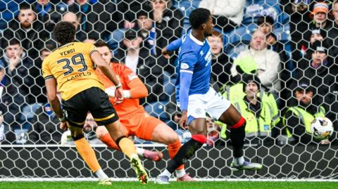 Livingston's Tete Yengi has a shot blocked by Rangers' Emmanuel Fernandez