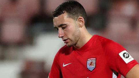 Kris Owens of Connah's Quay Nomads dejected at full time