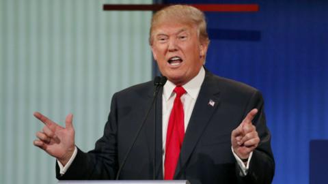 Donald Trump answers a question during a televised Republican debate in Cleveland, Ohio - 6 August 2015