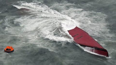 Keoyoung Sun, a South Korean-flagged chemical tanker, is capsized off the coast of Yamaguchi prefecture in western Japan, March 20, 2024, in this photo taken by Kyodo.