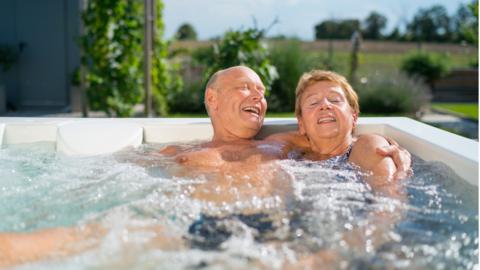 Retiree couple in a hot tub