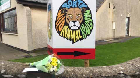 Zoo exterior with flowers in tribute to Lilleth the lynx