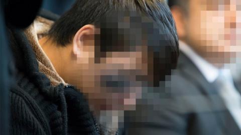 Hussein Khavari waits at a court room prior to the expected proclamation of sentence at the regional court in Freiburg