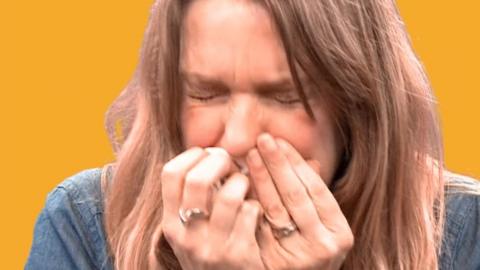 The BBC's Michelle Roberts blowing her nose