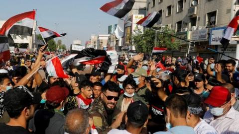 Demonstrators gather during a protest over corruption, lack of jobs, and poor services, in Baghdad