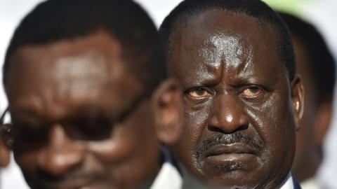 Raila Odinga (R) listens on as Siaya Senator James Orengo addresses the press in the Kenyan capital Nairobi on October 10, 2017.